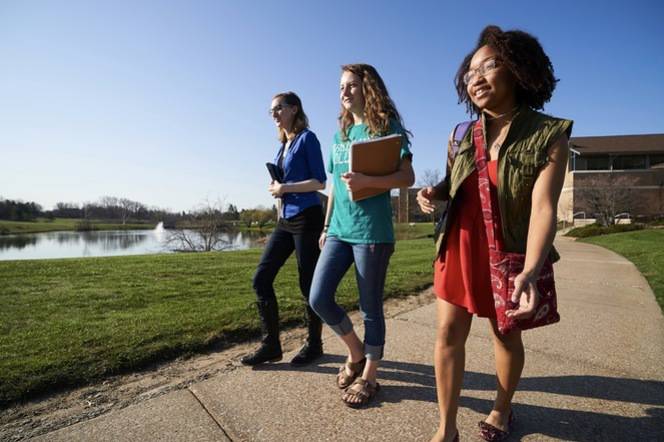 Ursuline students walking to class on a sunny day.