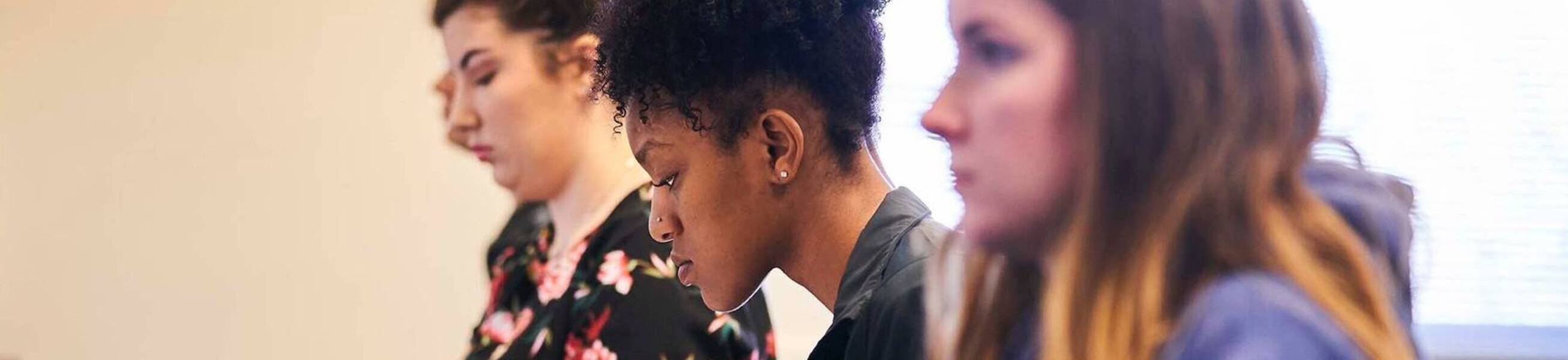 Ursuline college student looking at computer screen